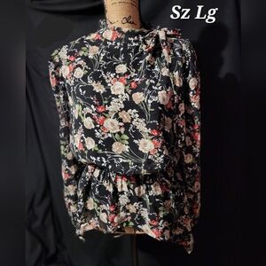 Floral printed peplum blouse with shoulder tie.